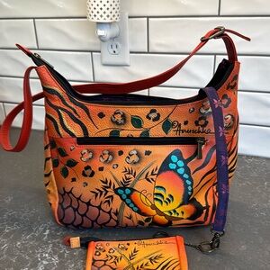 Anuschka genuine leather orange hand painter luxury bad. Gentle used.